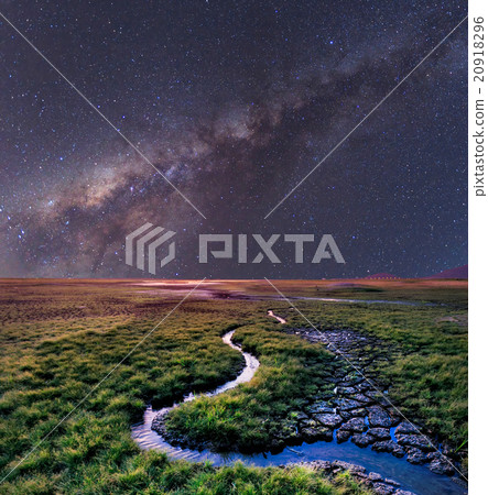 The Milky Way rises over the grass field, Thailand 20918296