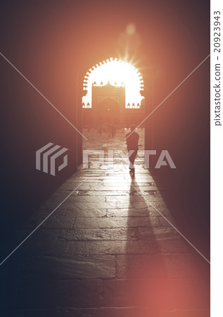 Silhouette of Man Walking Through Mosque Faith Concept Silhouette of Man Walking Through Mosque Faith Concept 20923943