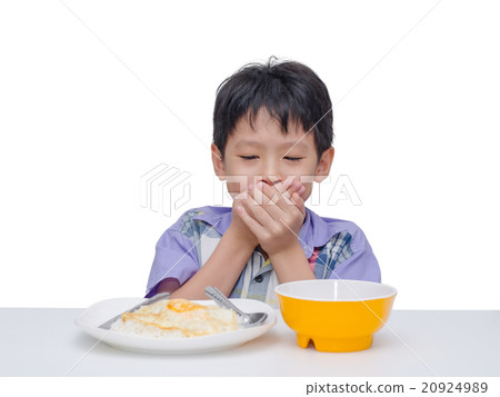 child close his mouth by hand between having lunch 20924989