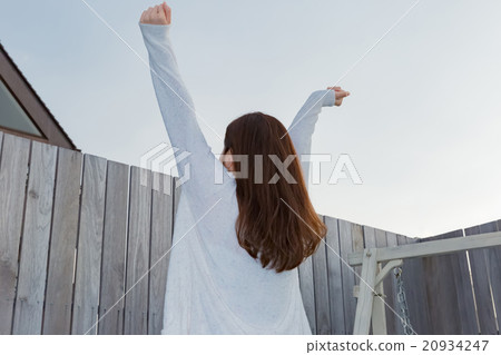 A woman in a pajamas with a stretch 20934247