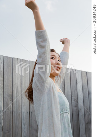 A woman in a pajamas with a stretch 20934249