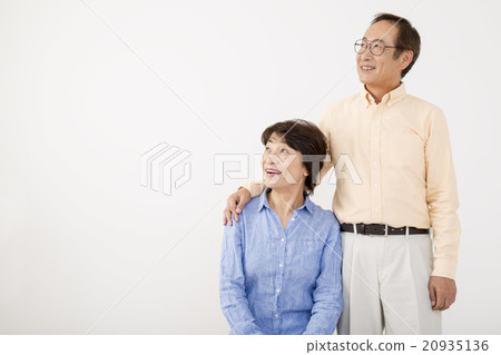 Senior couple cuddling with arms 20935136