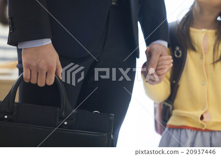 A daughter connecting hands with her father 20937446