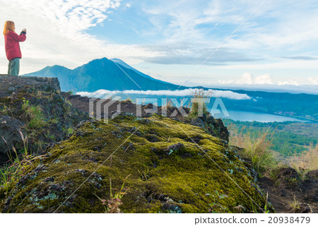 Young woman tourist photographing landscape 20938479