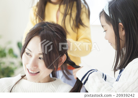 Children connecting their mother's hair 20939242