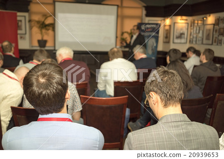 Rear view of business people at conference. Rear view of business people at conference. 20939653