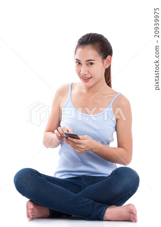 Happy young woman using smartphone 20939975
