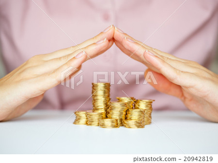 Protect new business start-up concept with hands and coin 20942819