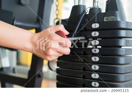 Exercise series : Adjusting weigh on exercise mach Exercise series : Adjusting weigh on exercise mach 20945115