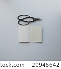 Small opened notebook and Japanese scissors 20945642