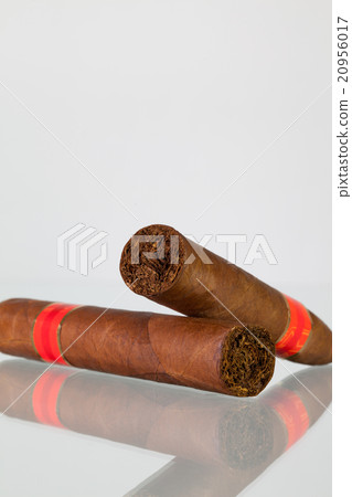 Different cigars on a  glass desk 20956017