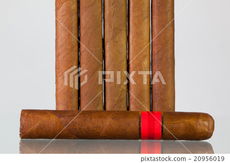 Different cigars on a  glass desk 20956019