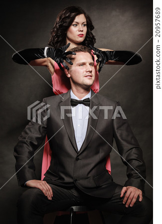 Woman in control of man 20957689