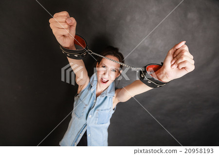 Arrest and jail. Criminal woman prisoner girl in handcuffs Arrest and jail. Criminal woman prisoner girl in handcuffs 20958193