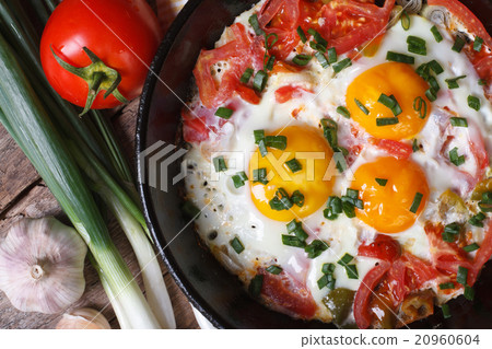 A hearty breakfast of fried eggs in a pan A hearty breakfast of fried eggs in a pan 20960604