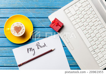 paper, gift, coffee and laptop lying on the table 20961955