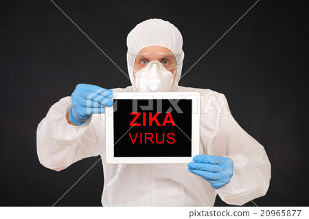 Researcher Holds Tablet with ZIKA Virus Sign 20965877