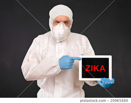 Researcher Holds Tablet with ZIKA Virus Sign 20965889
