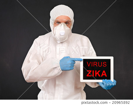 Researcher Holds Tablet with ZIKA Virus Sign 20965892