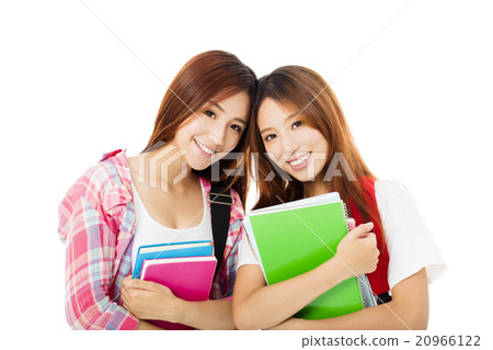 Two happy teenage students girls isolated on white Two happy teenage students girls isolated on white 20966122