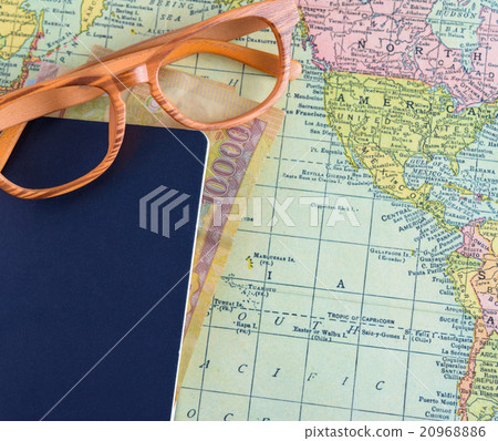 passport with money on world map background 20968886