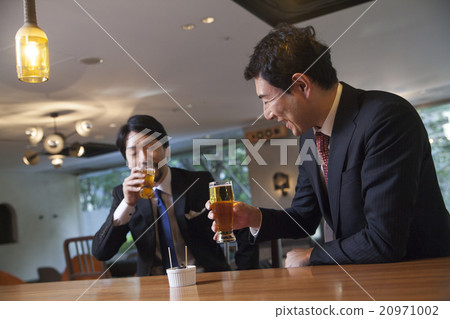 A businessman drinking beer 20971002