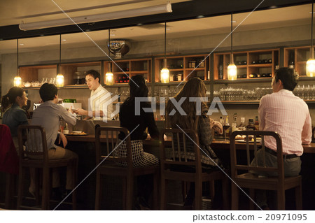 Male and female speaking at the counter 20971095