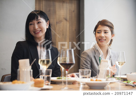 A woman eating dinner A woman eating dinner 20971147