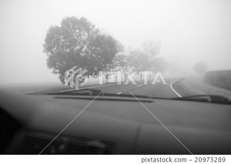 Car driving in the Fog Road Car driving in the Fog Road 20973289