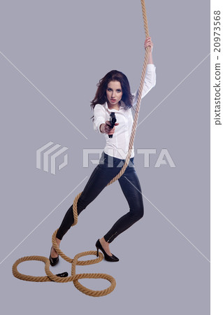 Young sexy Woman holding Handgun in hand Young sexy Woman holding Handgun in hand 20973568