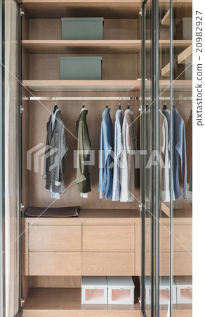 shirts and suite hanging on rail  20982927