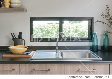 wooden kitchen counter with black granite on top 20984031