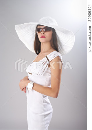 Fashionable lady in white clothes Fashionable lady in white clothes 20986304