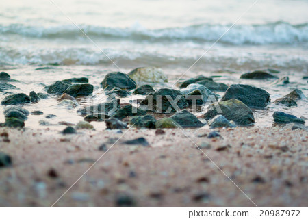 Rock in the sea with surf 20987972