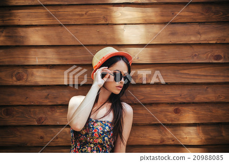 beautiful girl poses for camera in the city 20988085