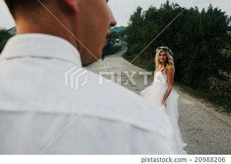 bride leads groom on the road bride leads groom on the road 20988206
