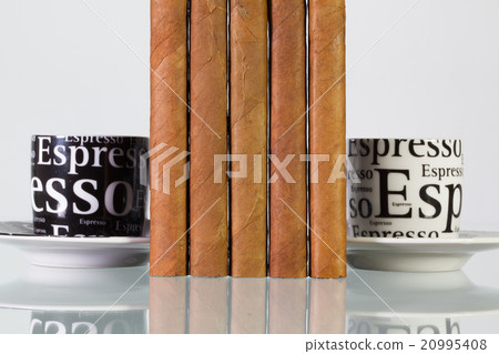 Different cigars and cups of coffee 20995408