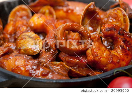fresh seafoos stew on an iron skillet 20995900