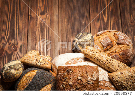 Bread assortment on wooden surface 20998577