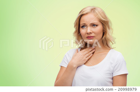 unhappy woman suffering from throat pain unhappy woman suffering from throat pain 20998979