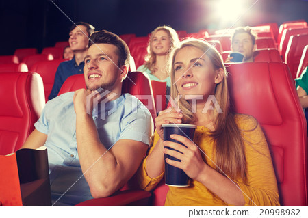 happy friends watching movie in theater happy friends watching movie in theater 20998982