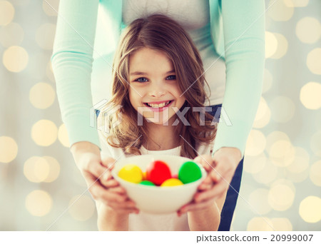 close up of happy family holding easter eggs close up of happy family holding easter eggs 20999007