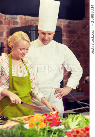 happy male chef cook with woman cooking in kitchen happy male chef cook with woman cooking in kitchen 20999334