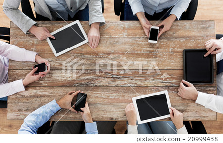 business team with smartphones and tablet pc business team with smartphones and tablet pc 20999438