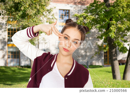 bored teenage girl making finger gun gesture bored teenage girl making finger gun gesture 21000566