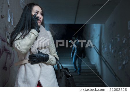 Young woman along at night at a danger Young woman along at night at a danger 21002828