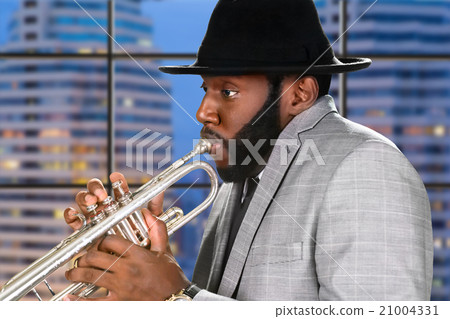 Evening performance of skillful trumpeter. Evening performance of skillful trumpeter. 21004331