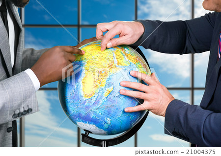 Globe on sky background. 21004375
