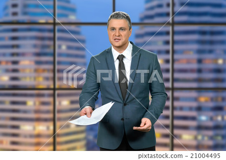 Adult businessman's evening paperwork. 21004495