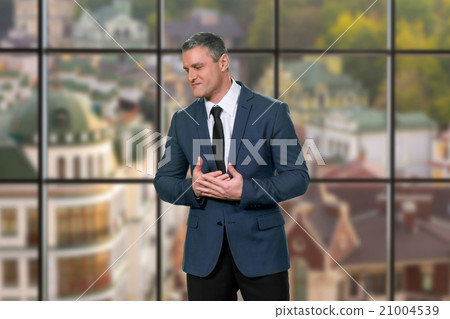 Angry businessman on urban background. 21004539
